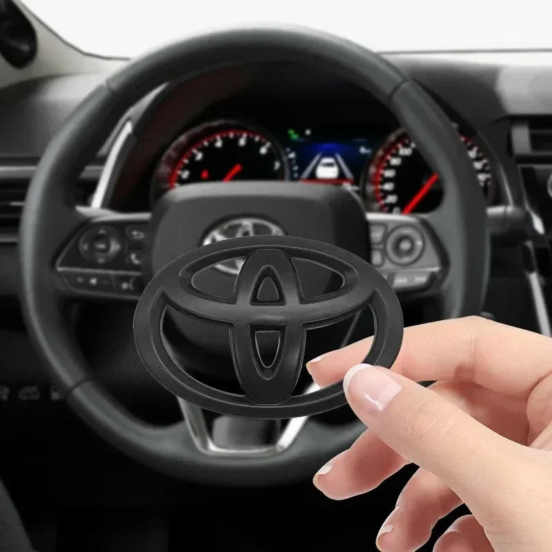1PC Car Steering Wheel Decorative Sticker 6.5X4.5cm Carbon fiber Emblem For Toyota Hilux Prius Avensis Verso Corolla Camry