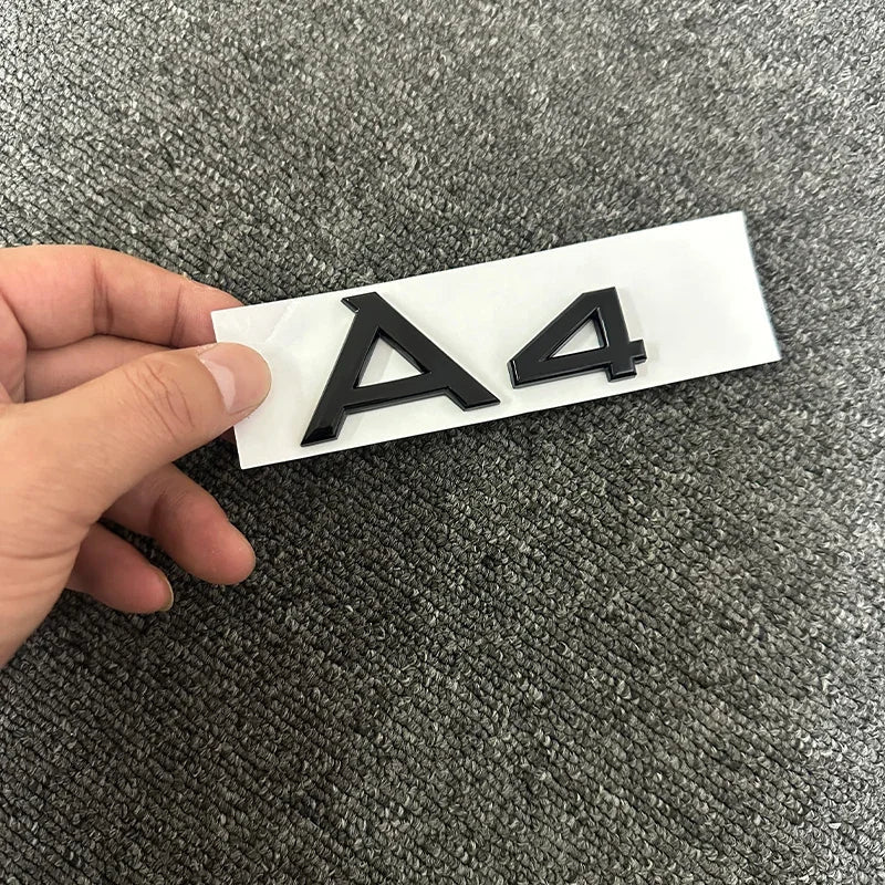 The new ABS letter 3D sticker Quattro Sline 2.0T is suitable for the modification of Audi A4 2008-2017 glossy black suitcase.