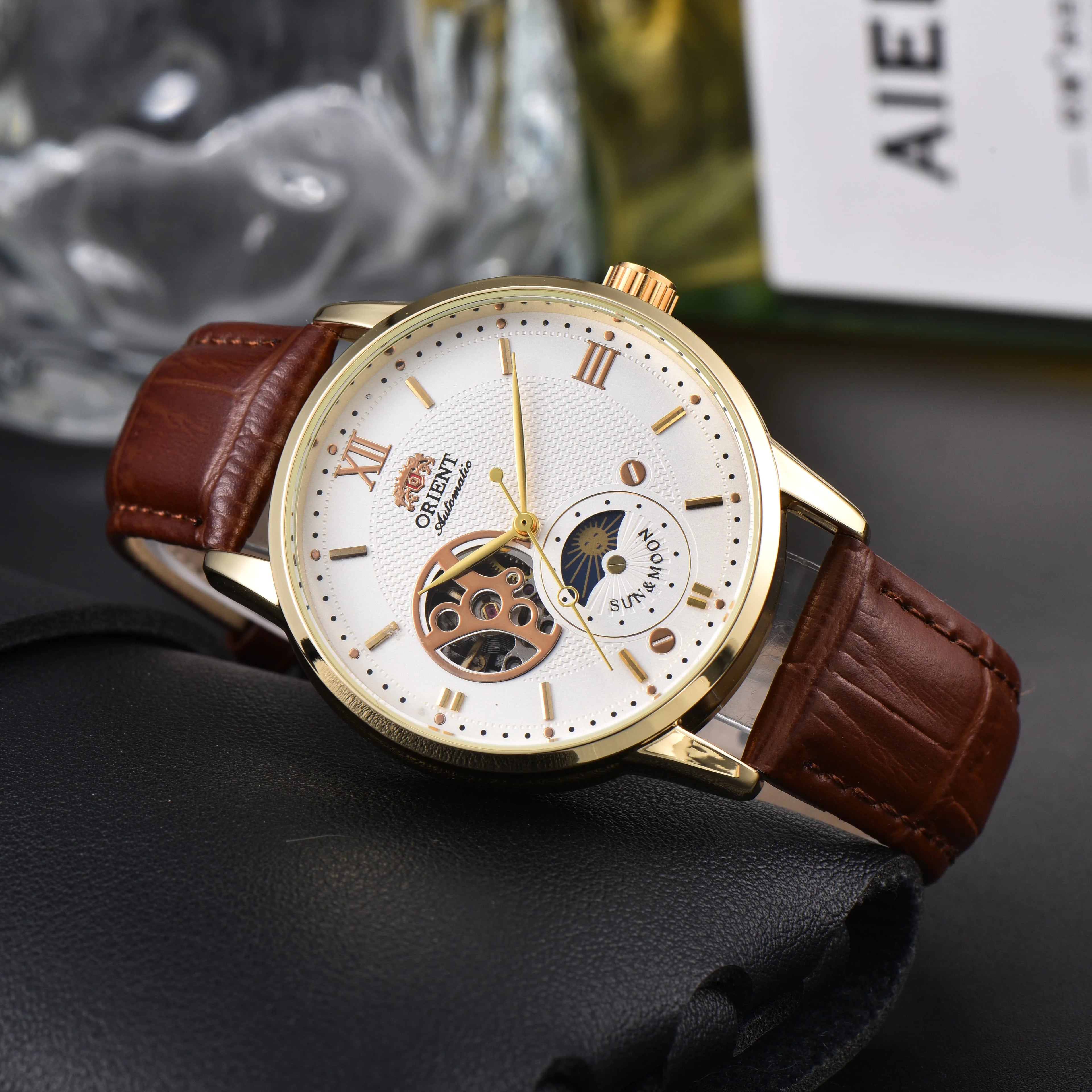 Orient Automatic Men's Watch Sun & Moon Phase Skeleton Dial Gold Case Black Leather Strap Mechanical Wristwatch