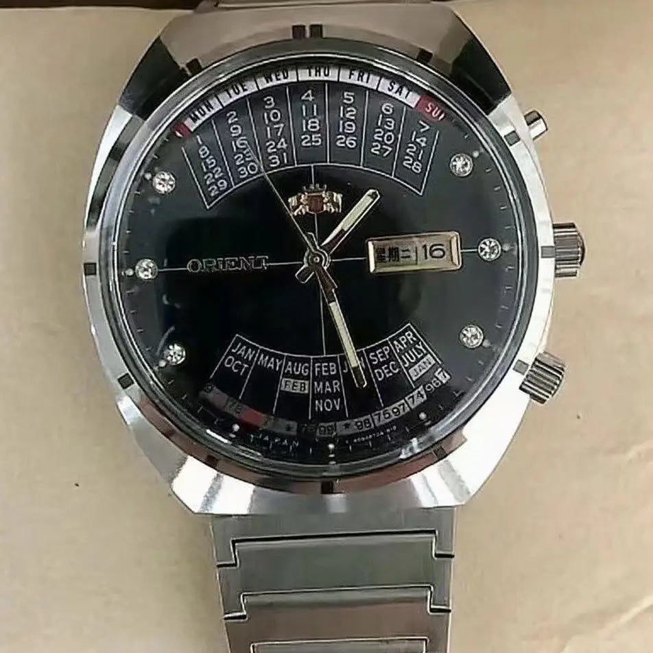 automatic mechanical Orient unisex watch with rotating large dial, fully functional stainless steel world time